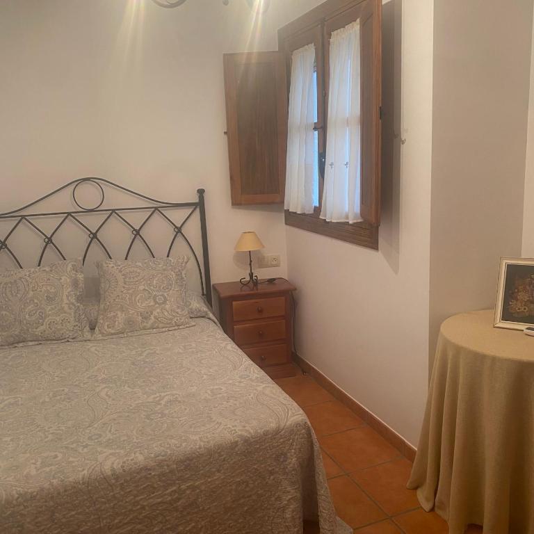 A bed or beds in a room at Casa rural La Aldea