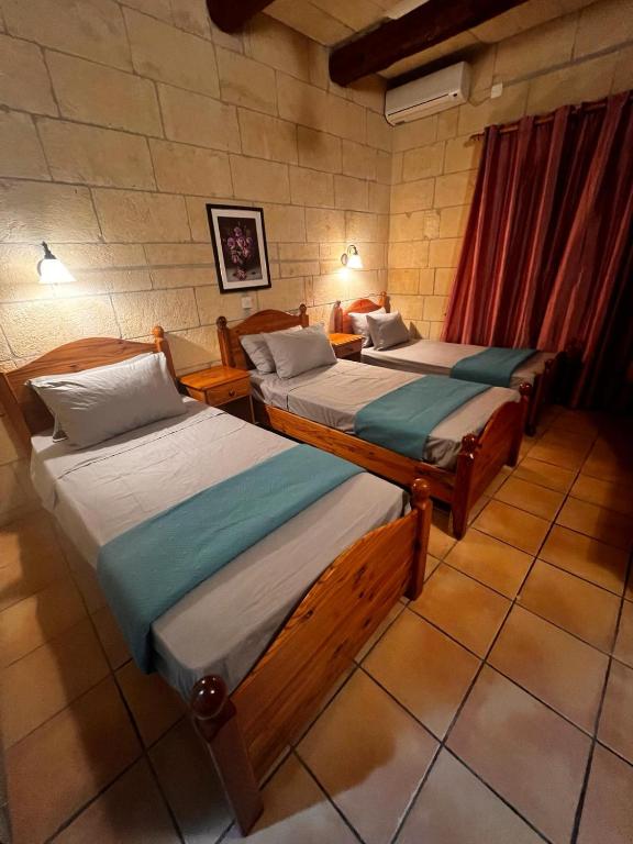 Letto o letti in una camera di Ortensia
