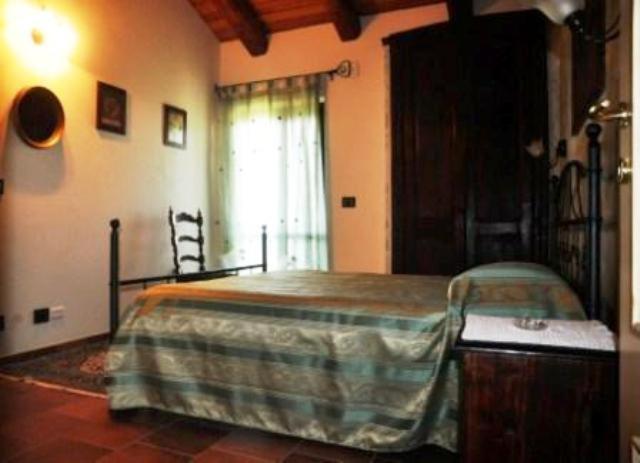 Postel nebo postele na pokoji v ubytování Agriturismo Brusalino
