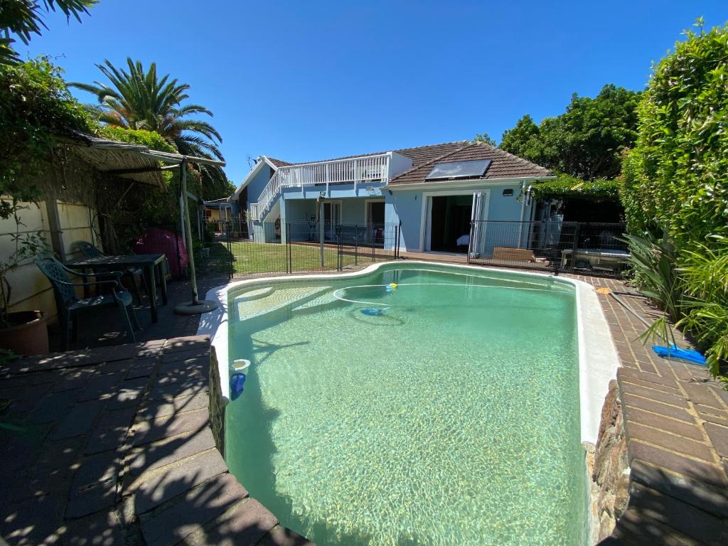 a swimming pool in the backyard of a house at Doordrift Extension in Cape Town