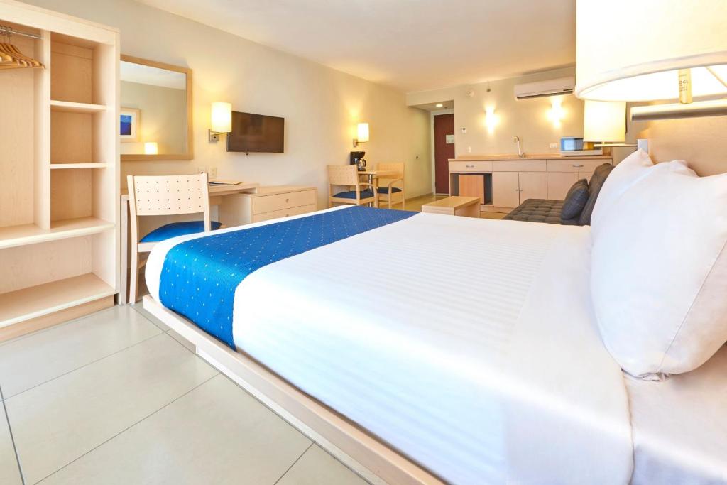 Postel nebo postele na pokoji v ubytování City Express by Marriott Minatitlán