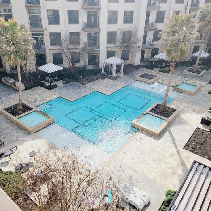 an overhead view of a swimming pool in a building at Relaxing Pool View Apt Reliant Stadium/Medical Center in Houston