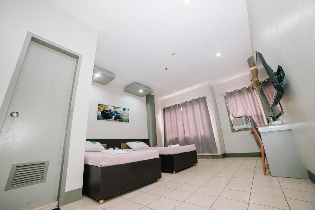 TV a/nebo společenská místnost v ubytování GC Hotel