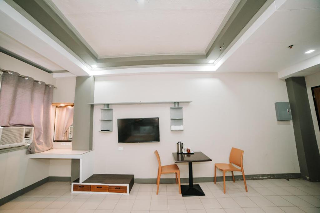 TV a/nebo společenská místnost v ubytování GC Hotel