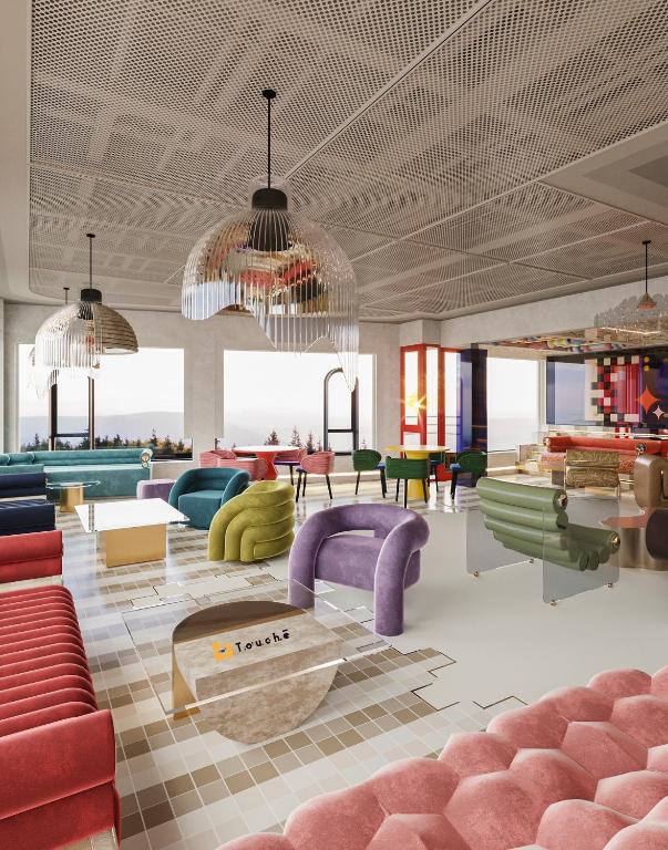 a lobby with couches and chairs and a table at Thien Thai Hotel & Spa in Hanoi