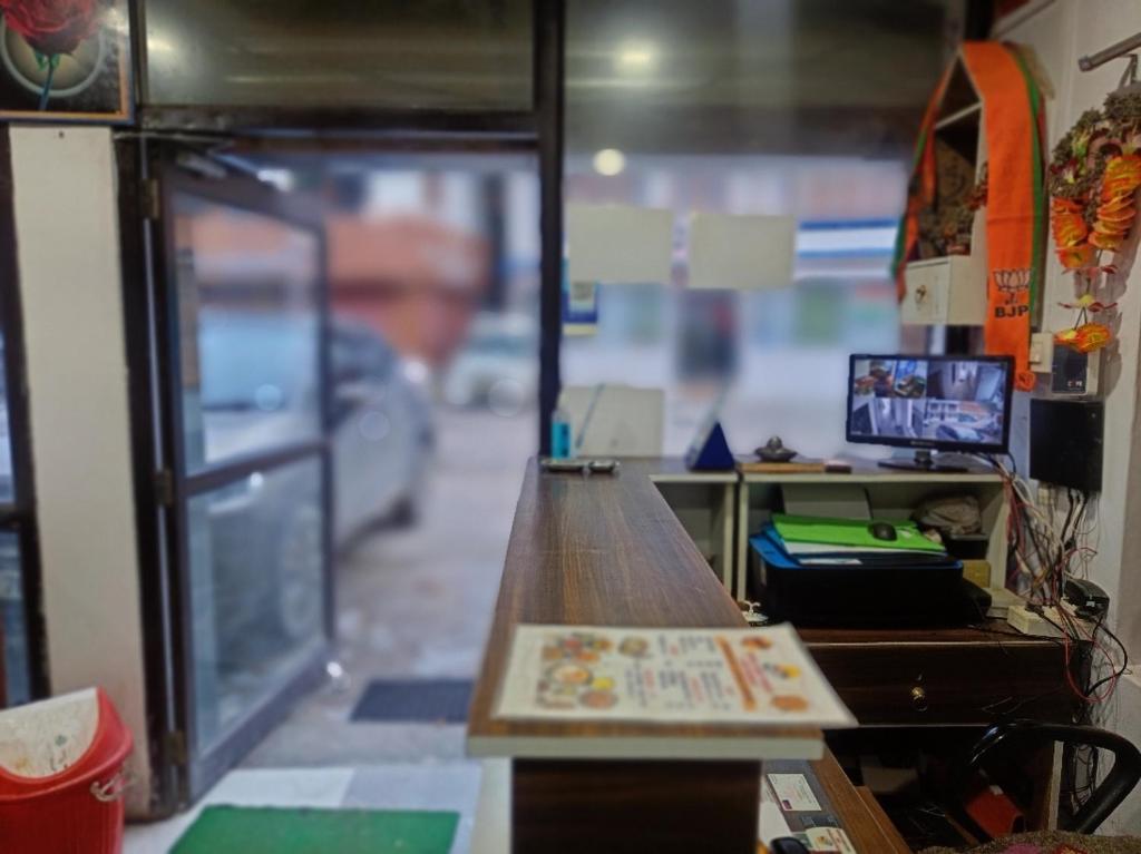 an office with a desk with a surfboard on it at RUPALI GUEST HOUSE in Badrinath