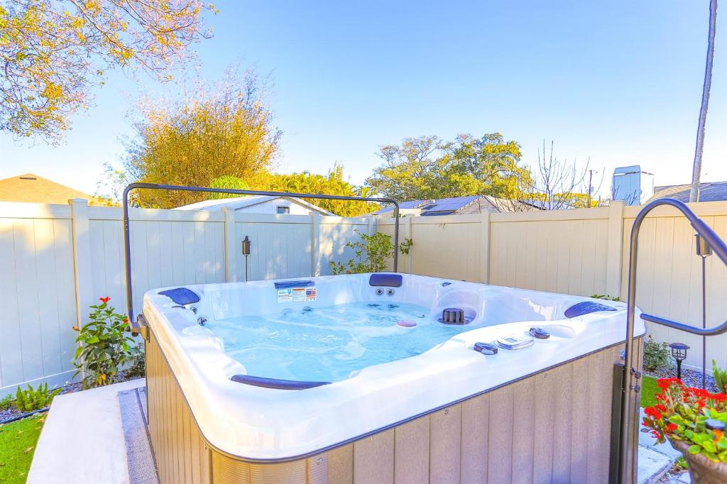 a jacuzzi tub sitting on a patio at Snook Haven - Hot Tub, Pool, Minigolf, Dog Space in Largo