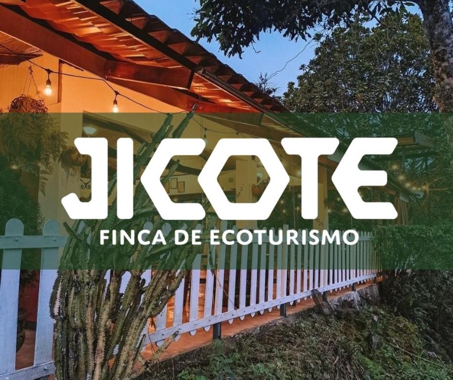 a sign for a house with a fence at Jicote finca de ecoturismo in Cartago