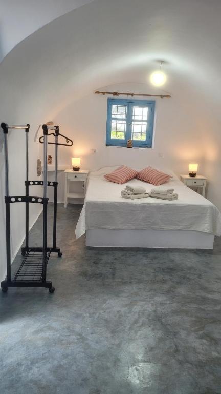 Postel nebo postele na pokoji v ubytování Fournos Aroniadika