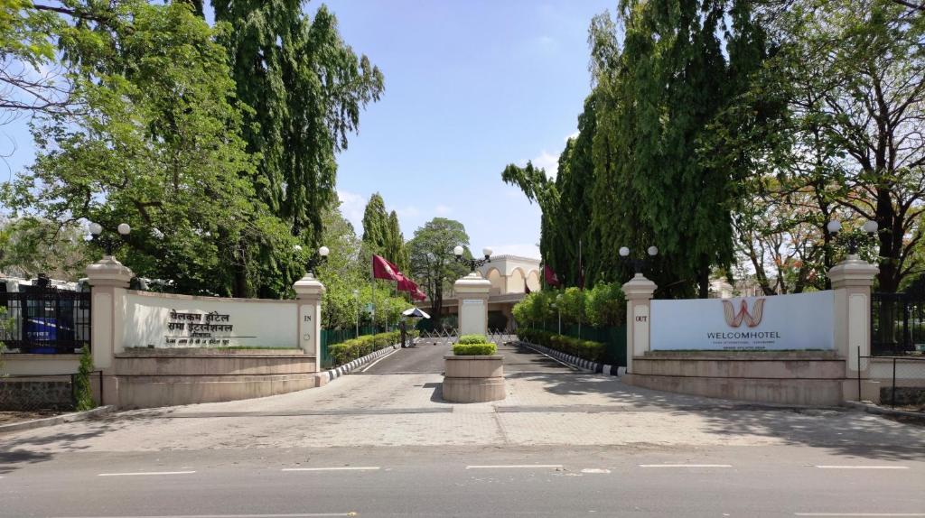 a gate to a house with a fence at Welcomhotel by ITC Hotels, Rama International, Aurangabad in Aurangabad