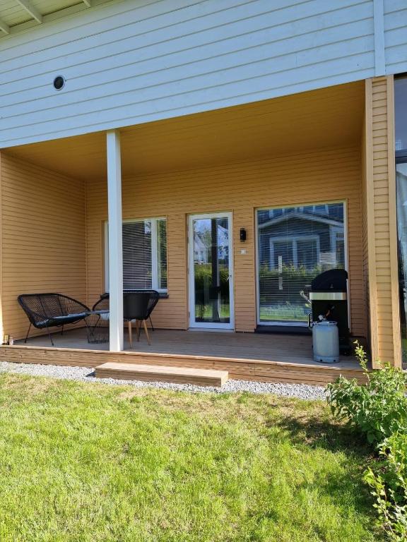 a front porch of a house with a grill at own sauna, barbeque and backyard, free parking in Tampere