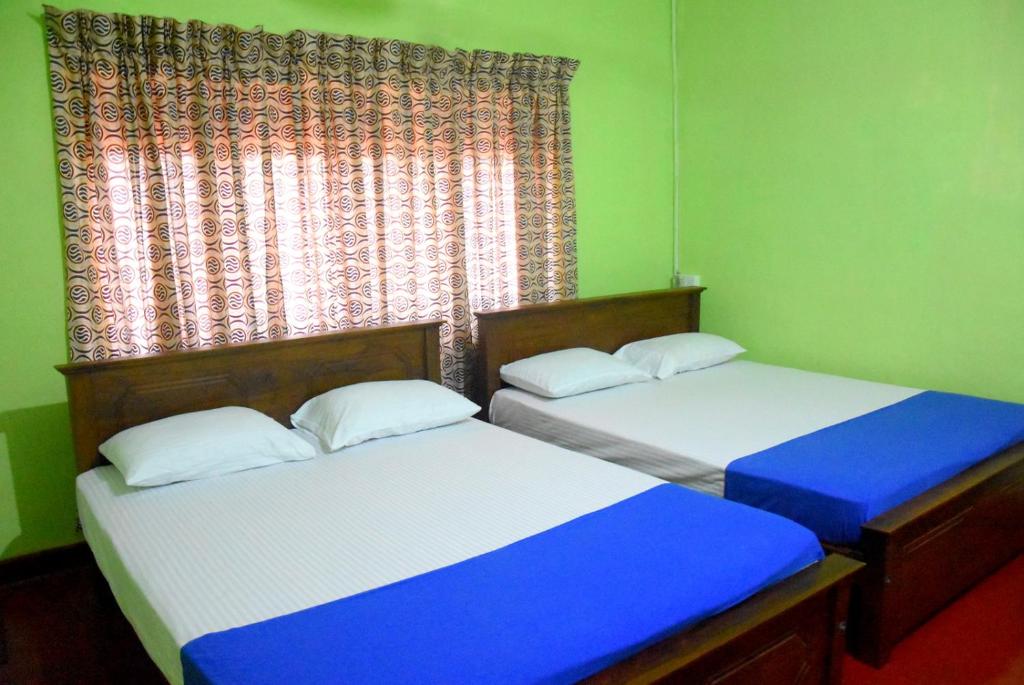 Postel nebo postele na pokoji v ubytování Vidu Guest Anuradhapura
