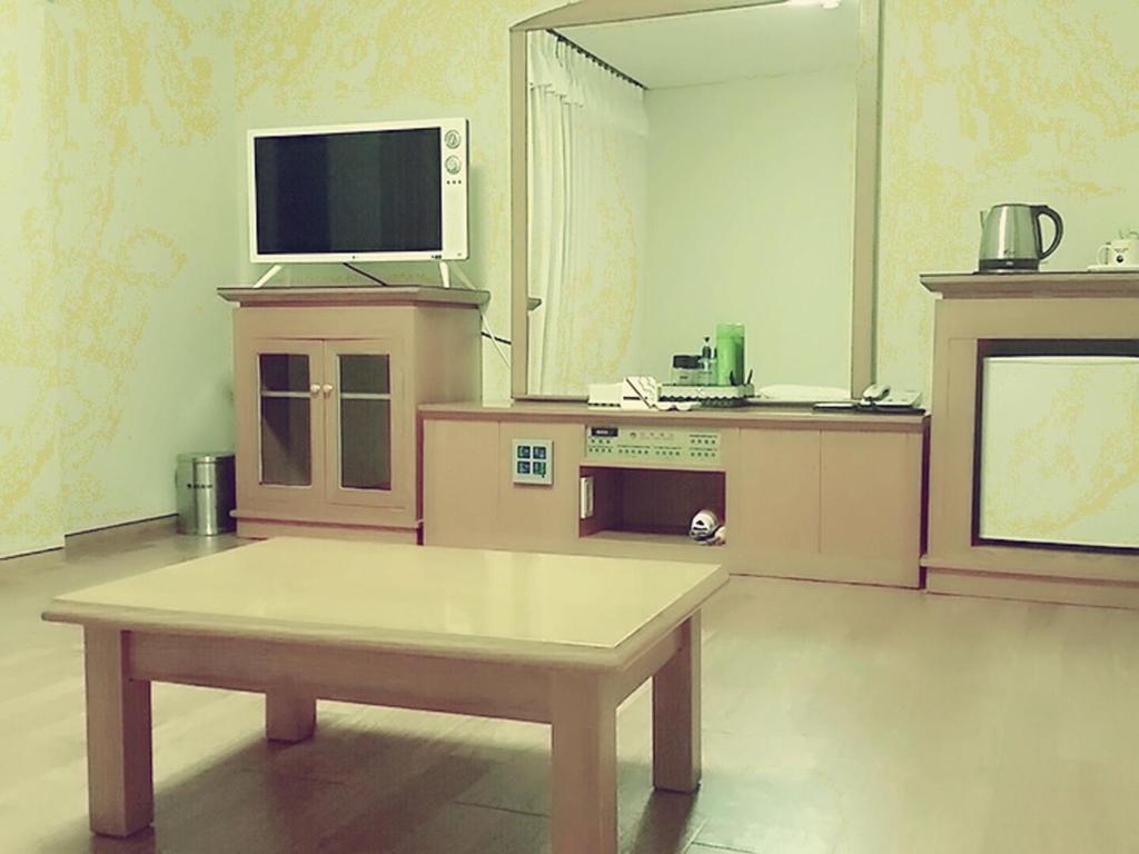 Kuchyň nebo kuchyňský kout v ubytování Daedong Hotel