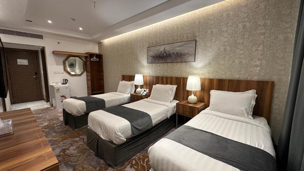 Postel nebo postele na pokoji v ubytování Multazam Al-Nnaseem Hotel