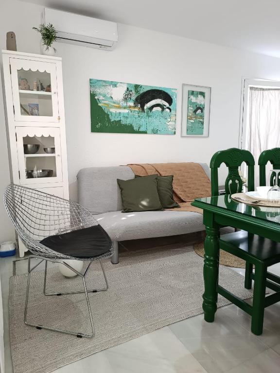 a living room with a couch and a table at Nao Victoria in Gelves