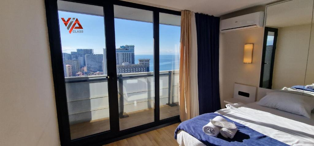 Postel nebo postele na pokoji v ubytování VIP CLASS ꙳ ORBI CITY