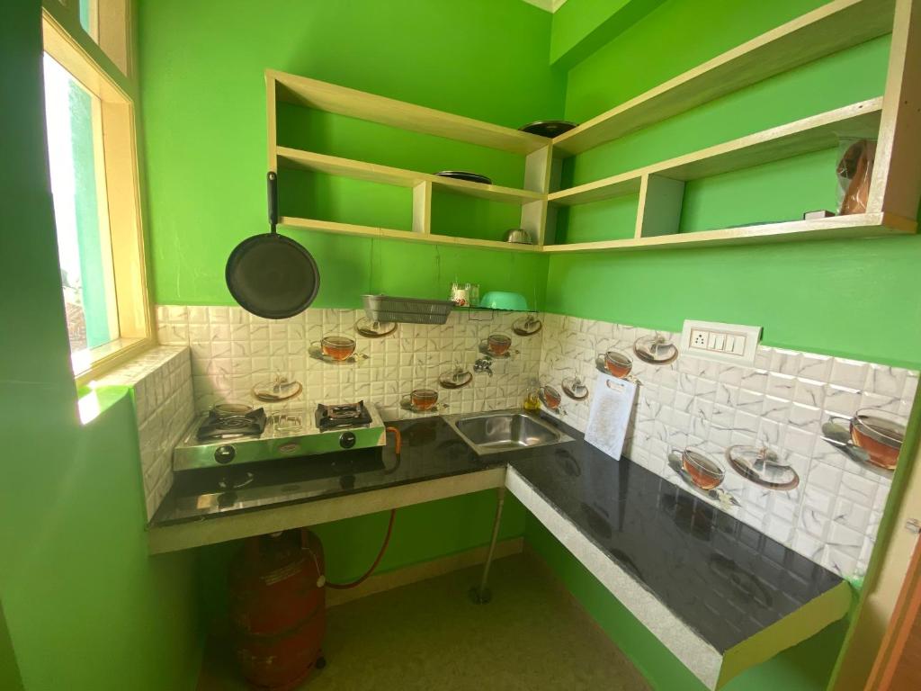 Kuchyň nebo kuchyňský kout v ubytování Jagatram Niwas Guesthouse Dharamkot
