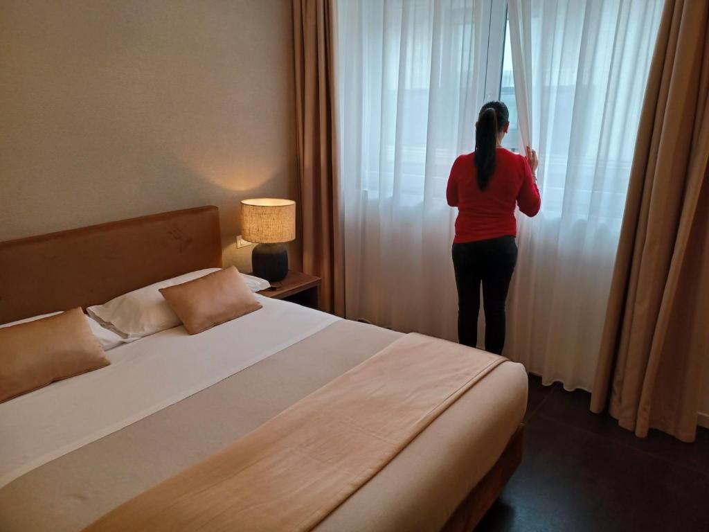 Postel nebo postele na pokoji v ubytování Outside Boutique Hotel