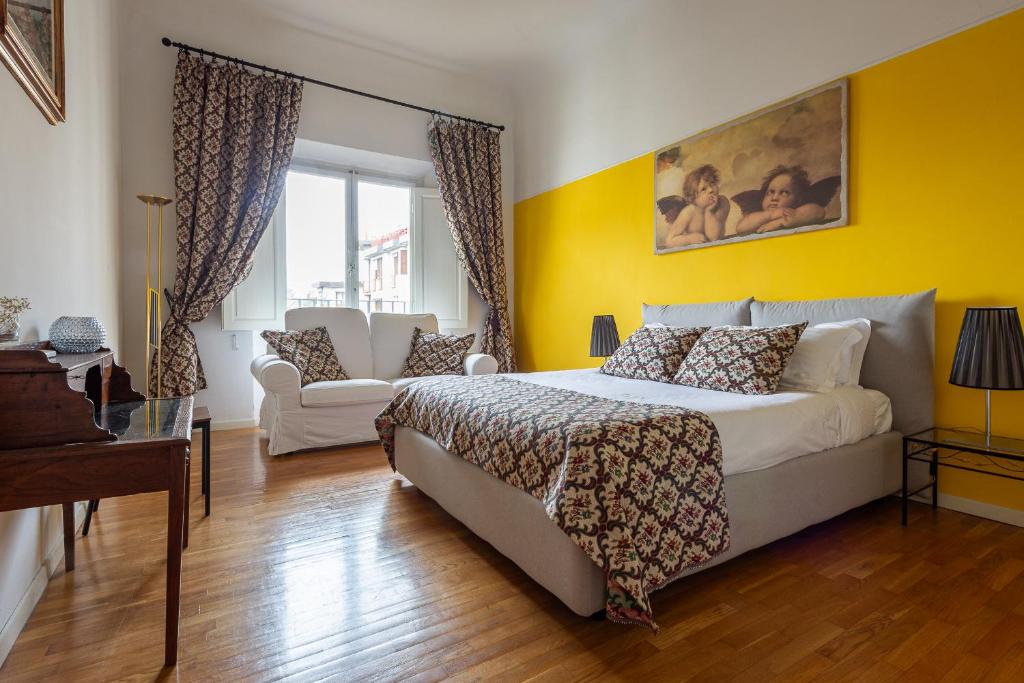 En eller flere senge i et værelse på Angelica House