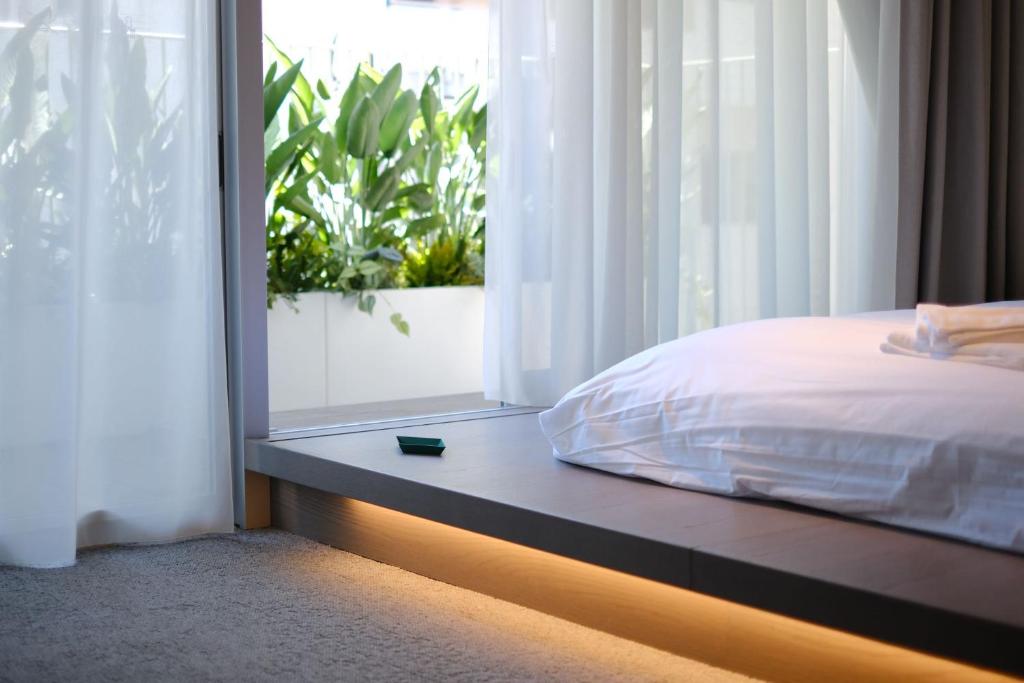 Postel nebo postele na pokoji v ubytování Hotel Rakuragu