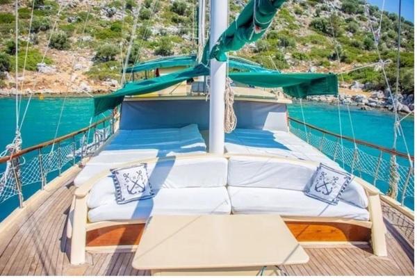 a boat with two beds on the deck at Derin Tekne in Göcek