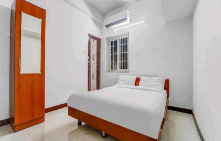 Кровать или кровати в номере Hotel Crown Tower