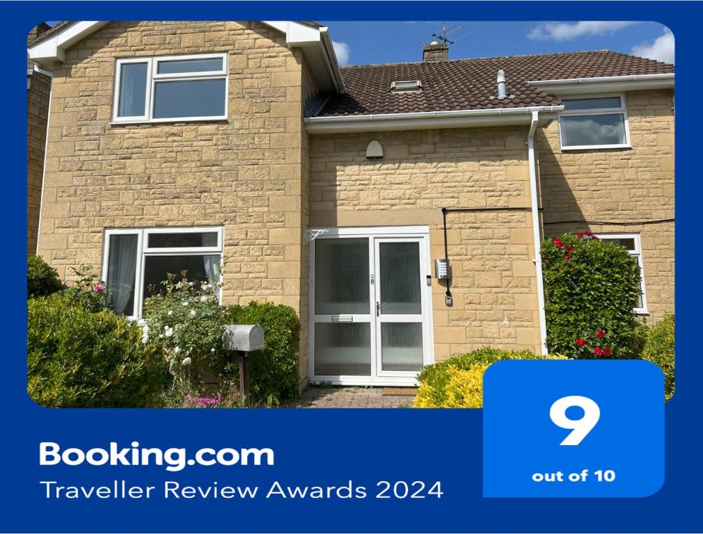 a house with a sign that says buyer review awards at Hill View House in Cheltenham