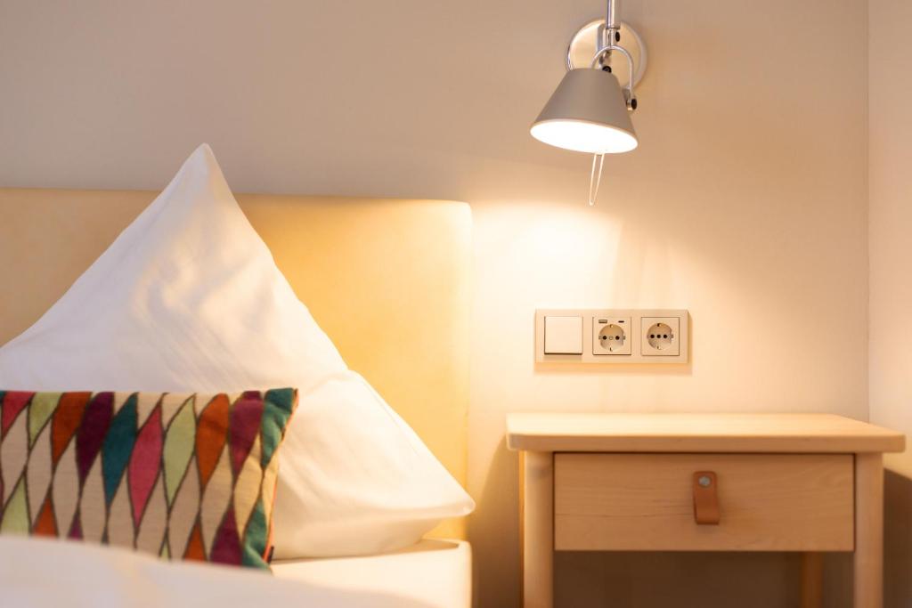 Postel nebo postele na pokoji v ubytování Hotel Herrnbrod & Ständecke