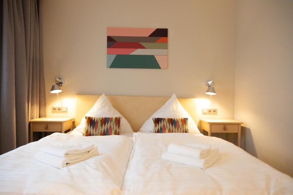 Postel nebo postele na pokoji v ubytování Hotel Herrnbrod & Ständecke