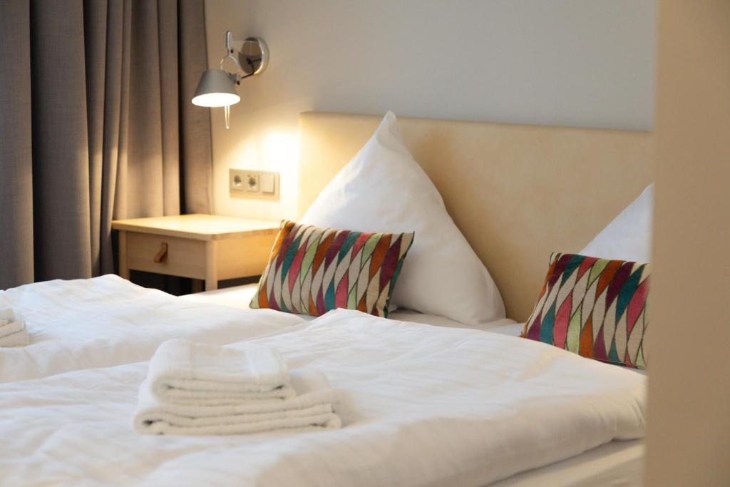 Postel nebo postele na pokoji v ubytování Hotel Herrnbrod & Ständecke
