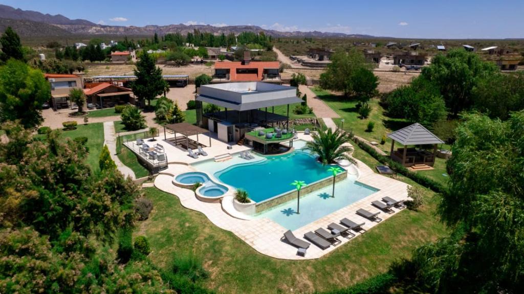 an aerial view of a resort with a swimming pool at Cabañas Rio Soñado in Valle Grande