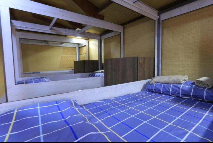 Postel nebo postele na pokoji v ubytování Yellow Hostel Dushanbe