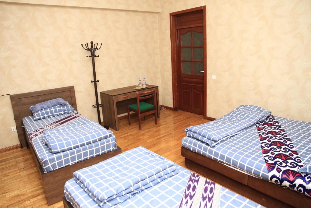 Postel nebo postele na pokoji v ubytování Yellow Hostel Dushanbe
