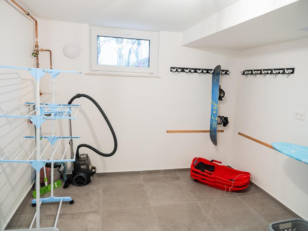 a room with a red bag on the floor at Ferienhaus Waldzauber-Winterberg in Winterberg