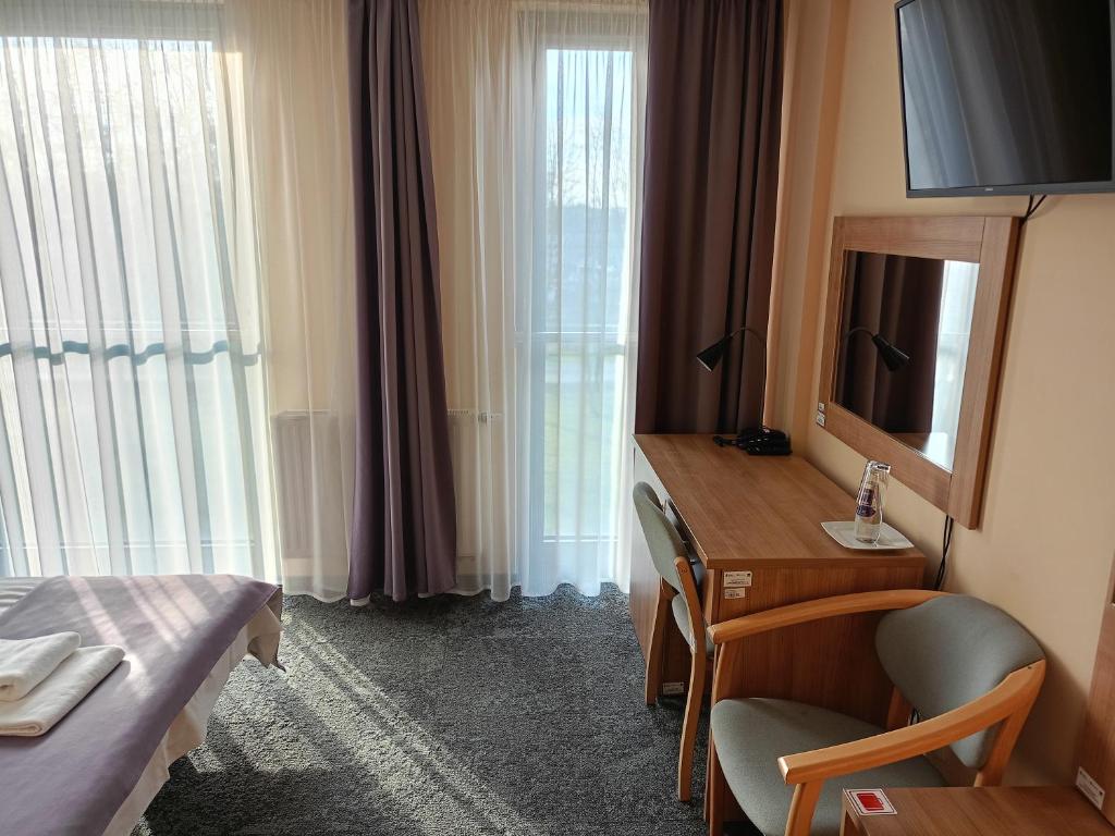 TV a/nebo společenská místnost v ubytování Hotel Olimpijski