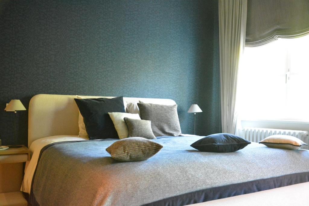 Postel nebo postele na pokoji v ubytování B & B Landhuis Ter Velt