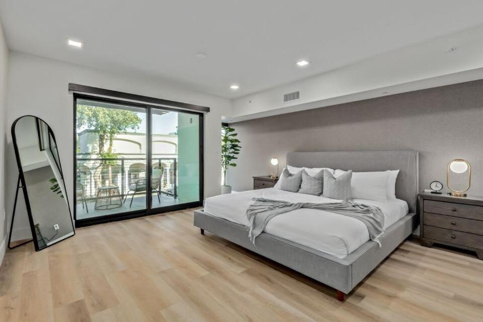 a bedroom with a large bed and a large window at LUX at Craftsman - Heart of Old Town Studio 2 in Scottsdale