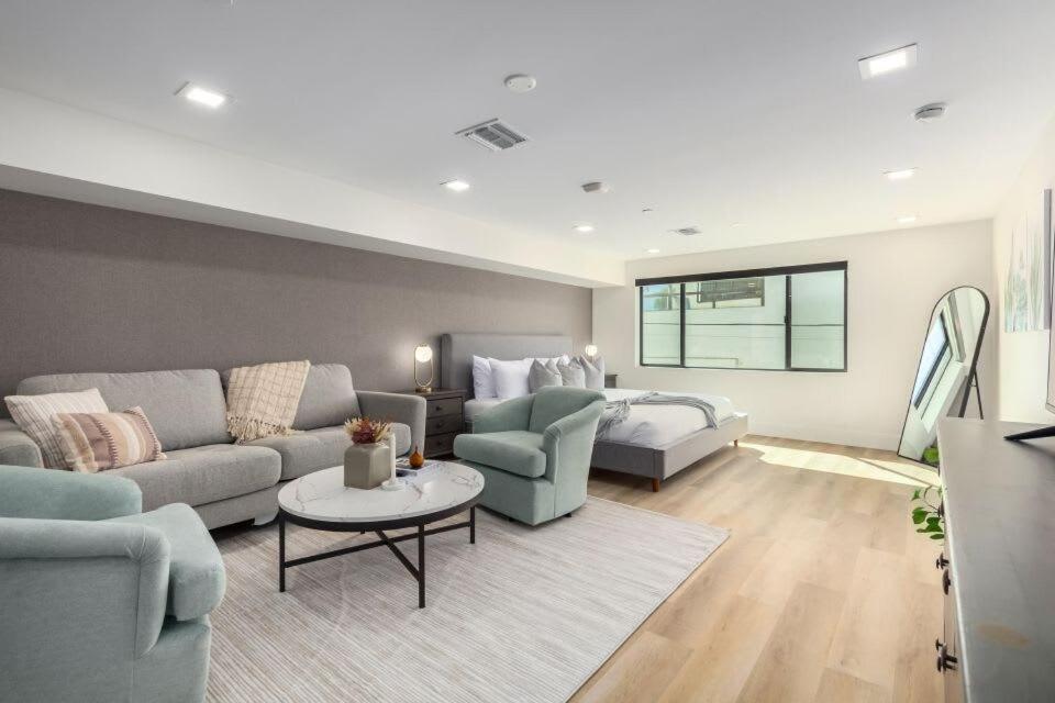 a living room with a couch and a table at The LUX at Craftsman - Heart of Old Town Studio 3 in Scottsdale