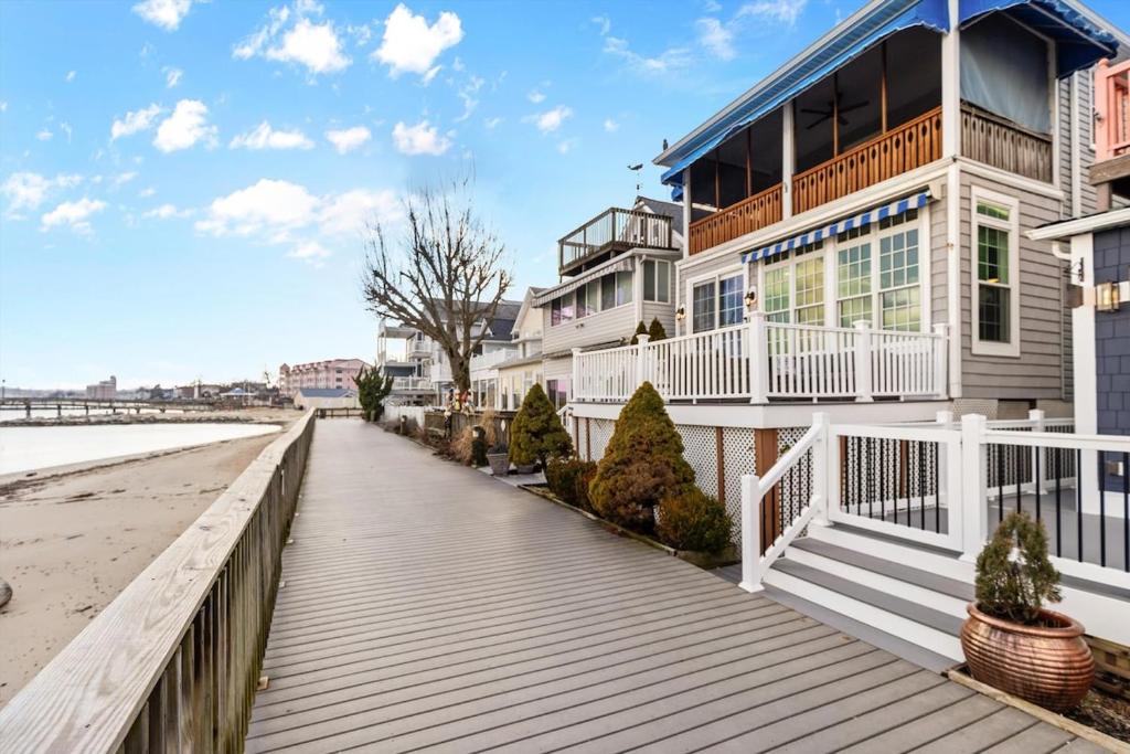 a house on the beach with a boardwalk at 3-BR Getaway on the Chesapeake Bay in North Beach