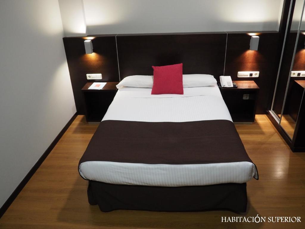 Postel nebo postele na pokoji v ubytování Hotel Junquera