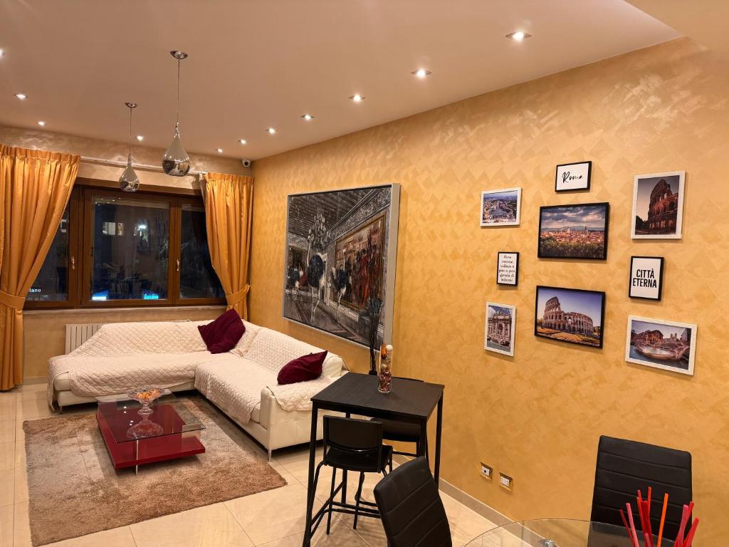 a living room with a couch and a table at LA TORTORELLA HOME DI ROMA TALENTI in Rome