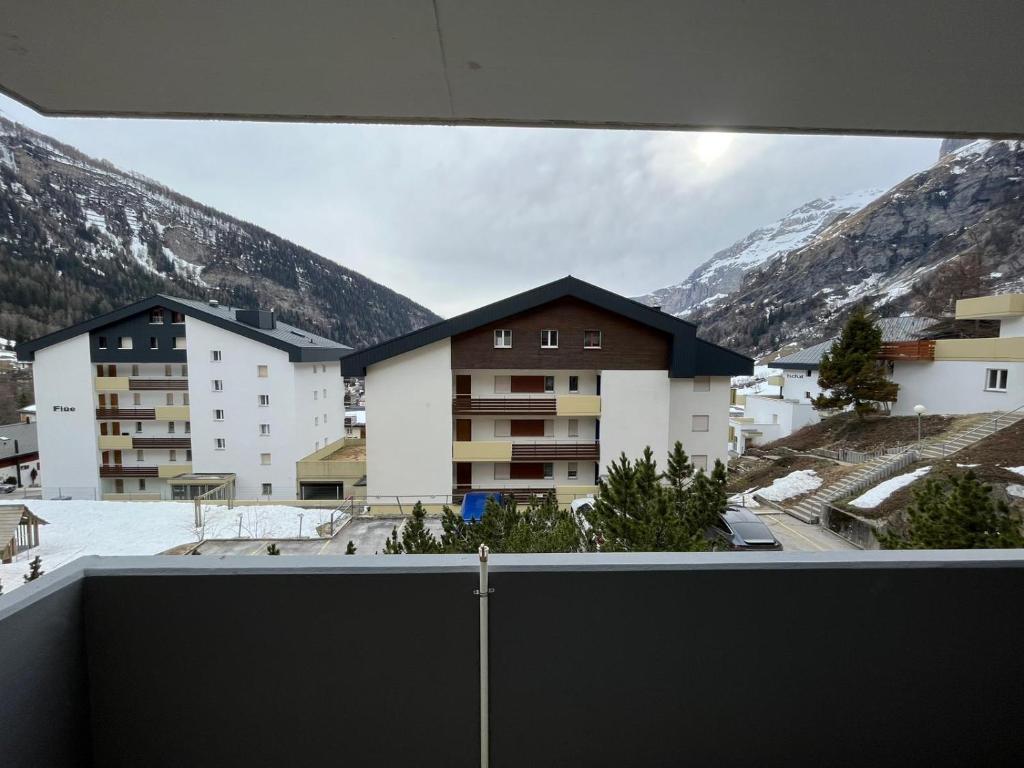 a view from the balcony of a building with mountains at Montanji 11 in Leukerbad