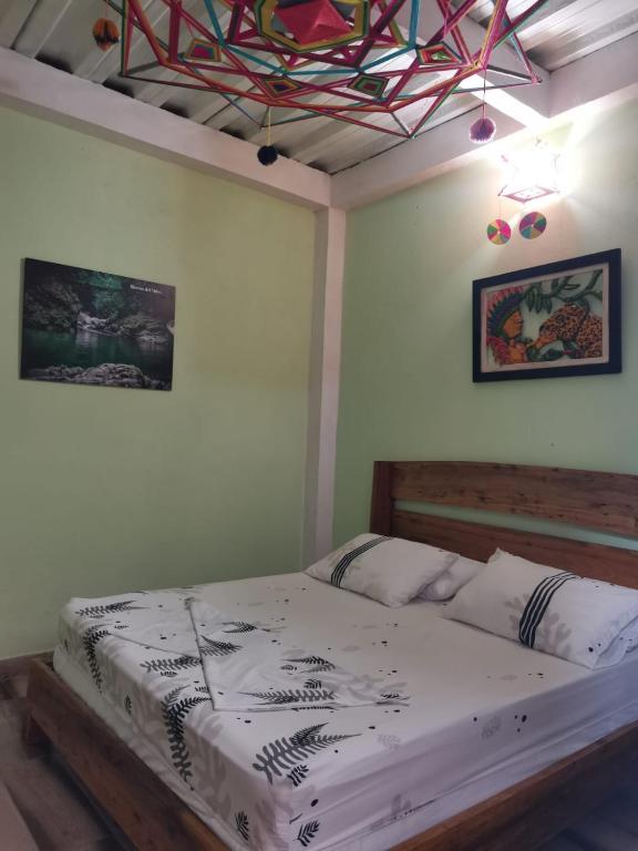 Una cama o camas en una habitación de POSADA KAUAI