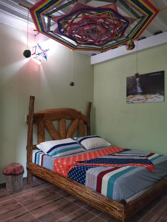 Una cama o camas en una habitación de POSADA KAUAI