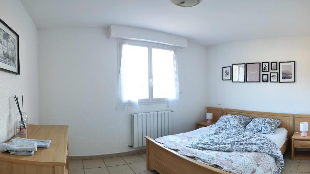 Posteľ alebo postele v izbe v ubytovaní Appartement avec une belle vue sur Palalda