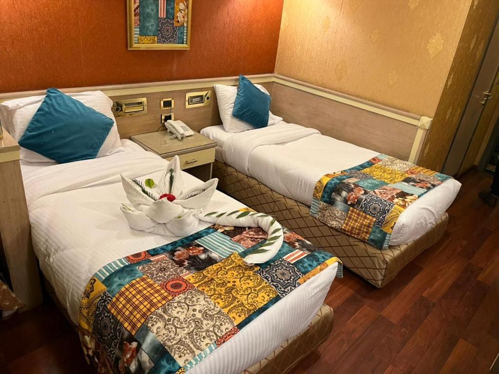 فندق ميس إيجيبت - Miss Egypt Hotelにあるベッド