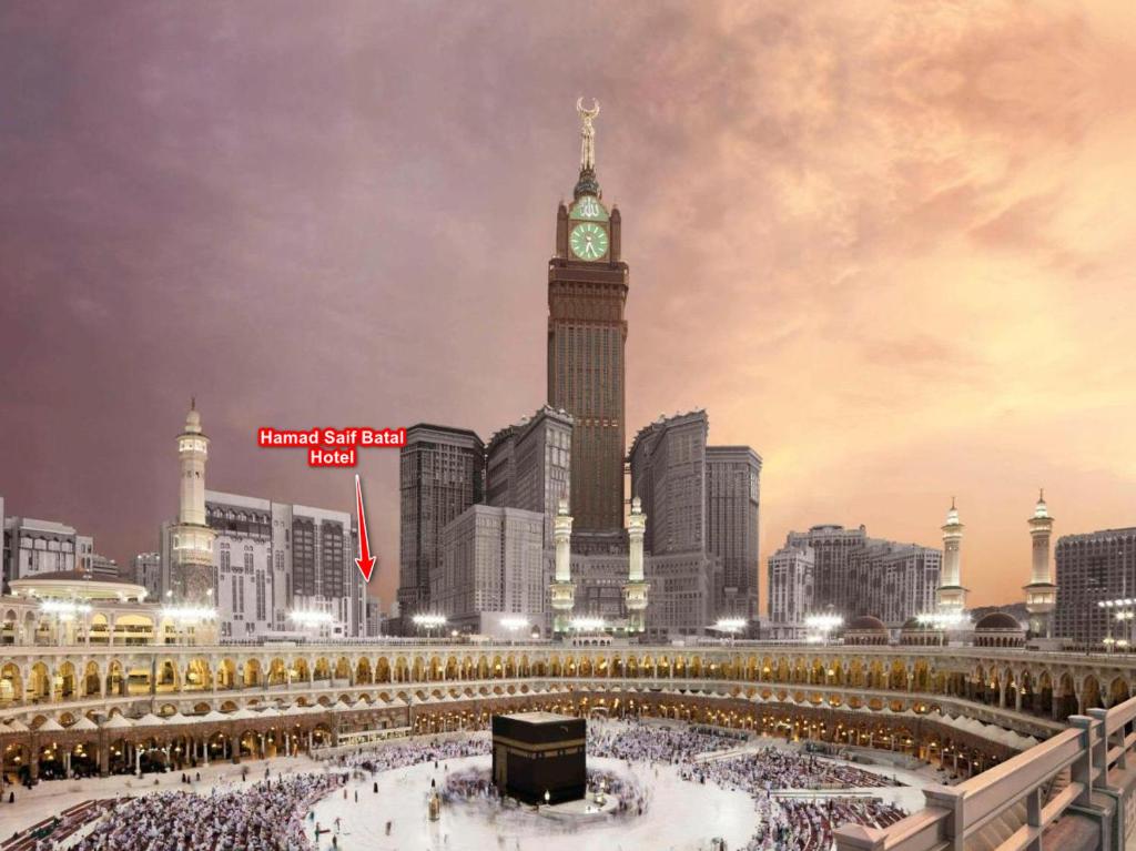 a large city with a clock tower in front at Hamad Saif Batal Hotel in Mecca
