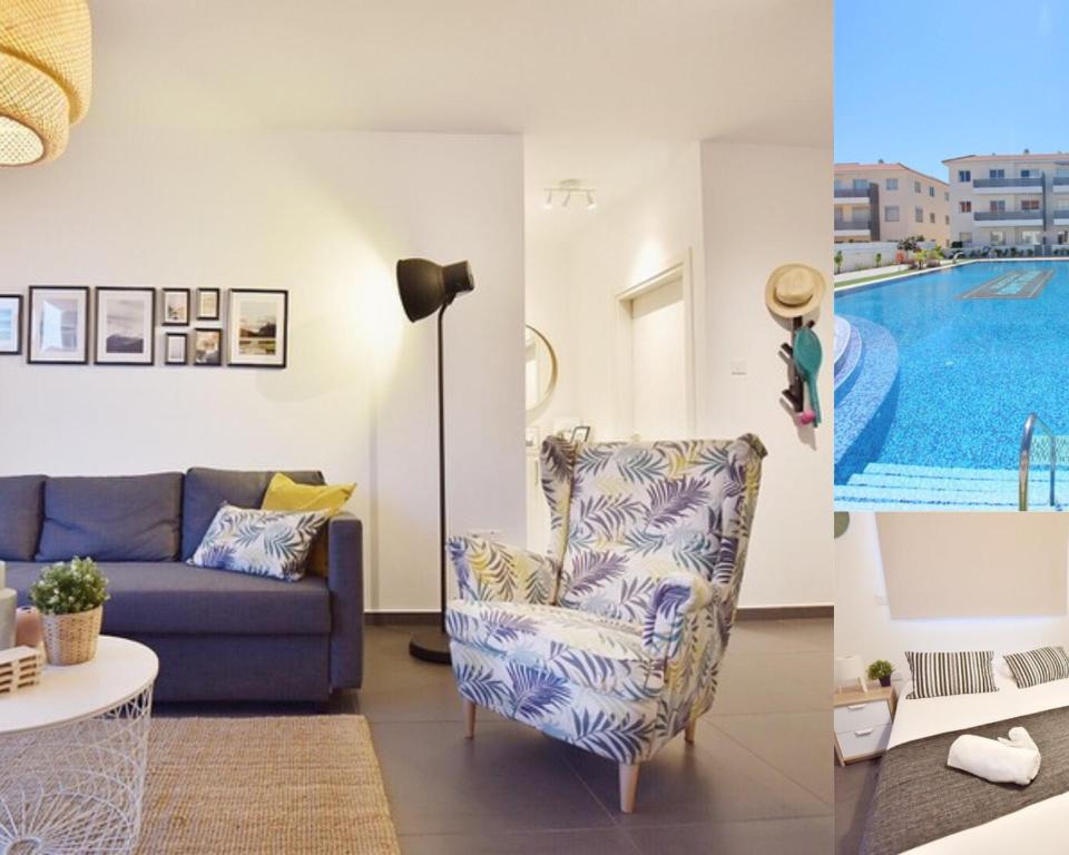 a living room with a couch and a swimming pool at Limegrove Holiday Apartment in Protaras
