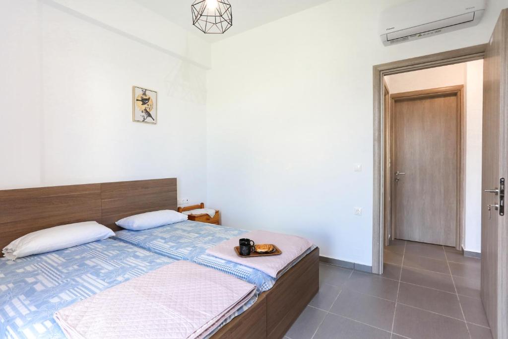 Postel nebo postele na pokoji v ubytování Nikolas Villa