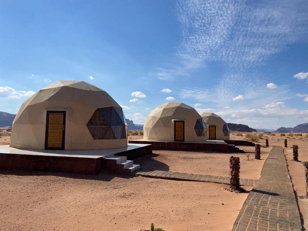 two domes in the middle of the desert at Wejdan Rum Luxury Camp in Wadi Rum